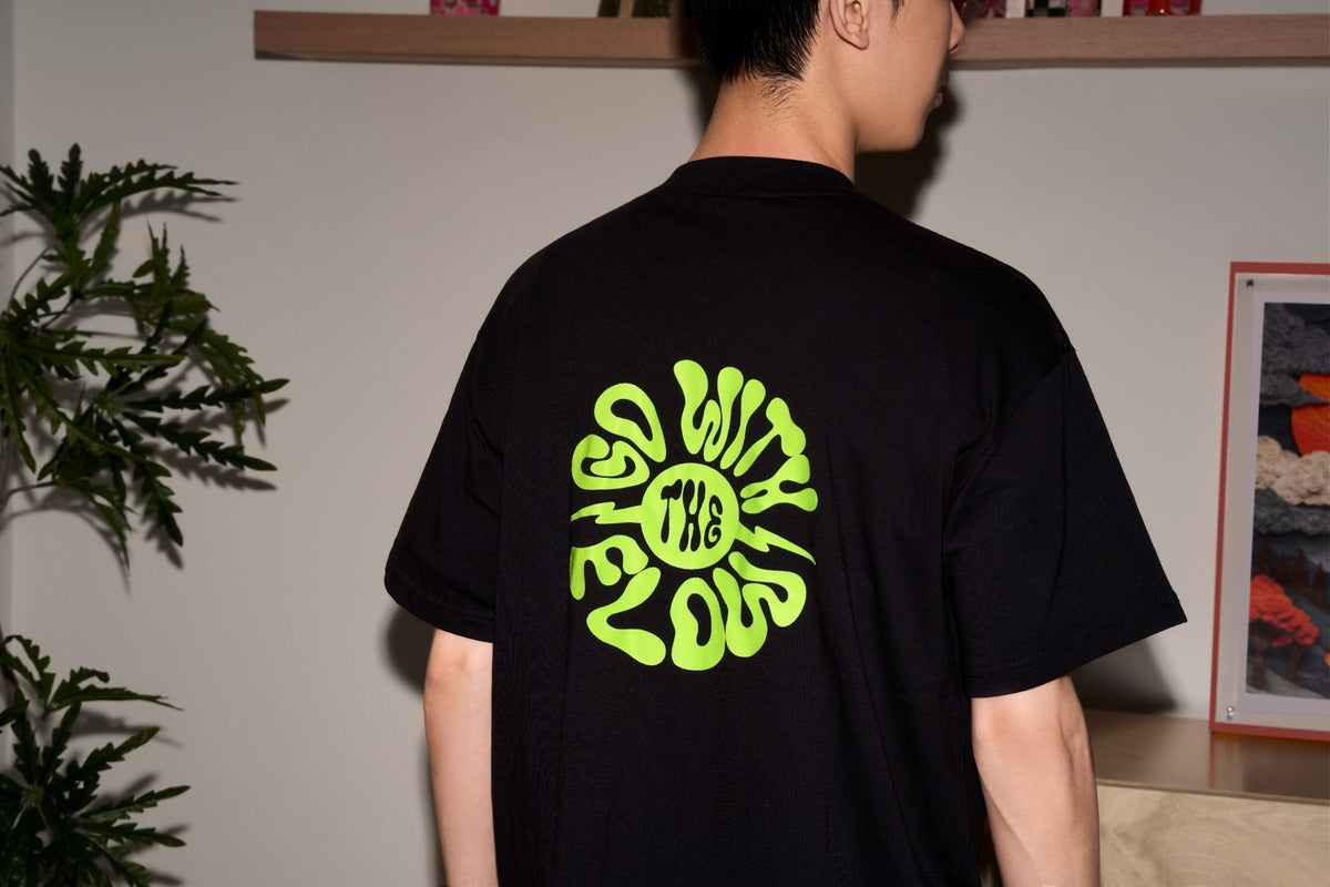 Black T-shirt with a bright green graphic made using glow-in-the-dark DTF film
